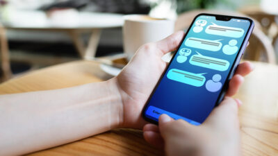 person on their smartphone and contacting online support