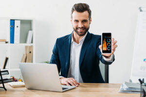 banking professional holding mobile phone and showing how he's using generative AI for financial services
