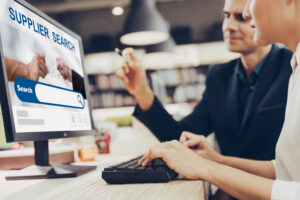two business people using internet search